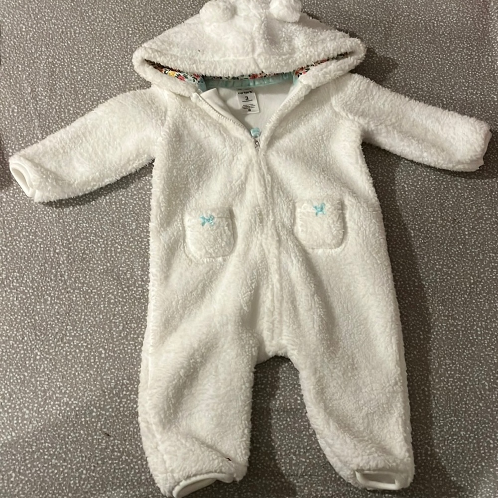 It’s a 3 month old white winter onesie from carters.